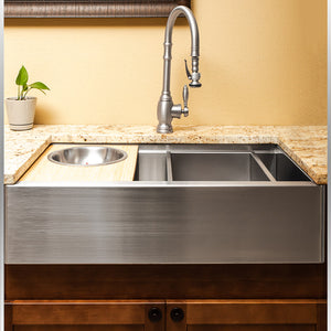 Luxury workstation sink accessory - drop in bowl on the right and cutting board with mixing bowl on left sink of the sink 
