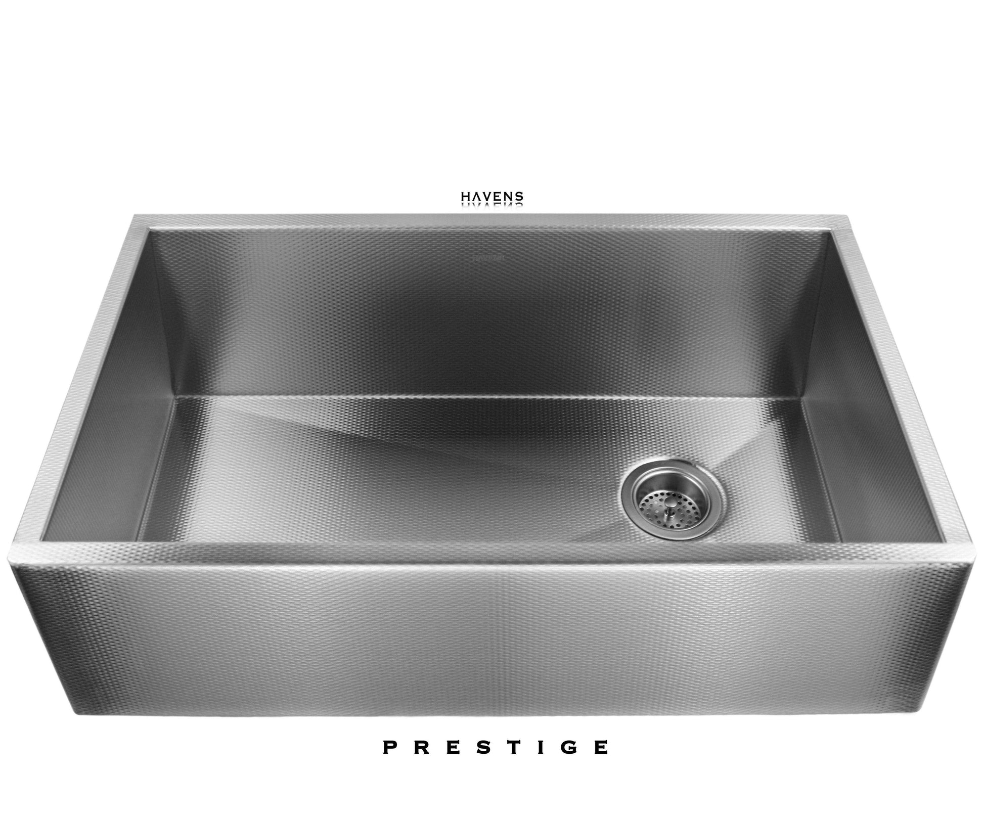 Textured stainless steel farmhouse kitchen sink with a right rear drain.