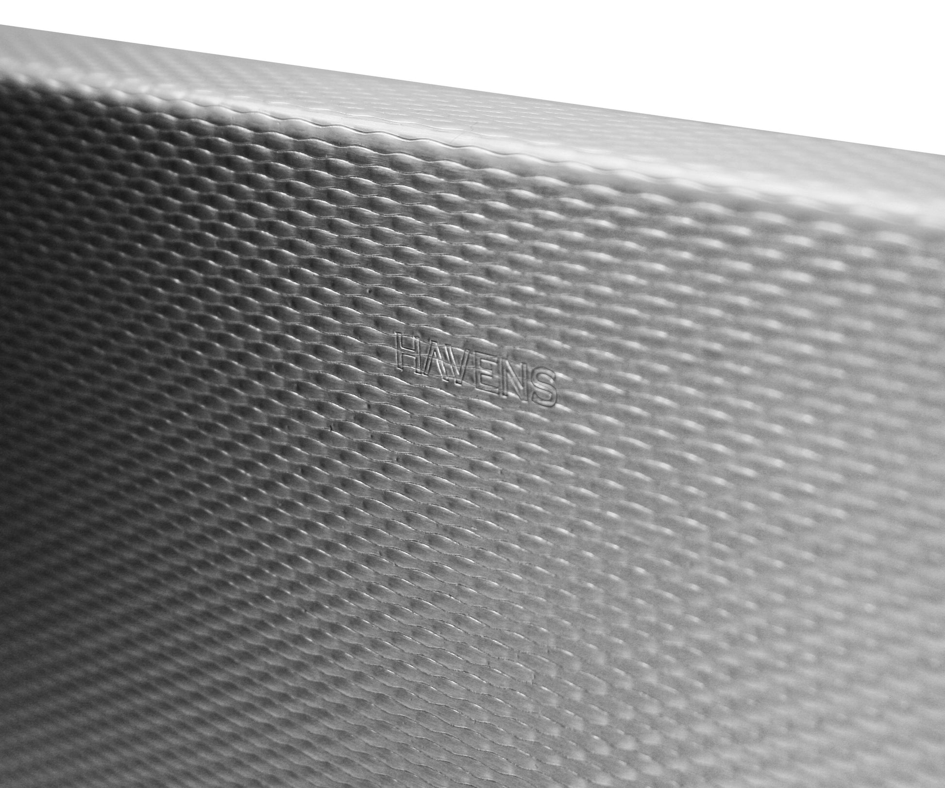 Textured stainless steel in a kitchen sink.