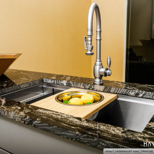Legacy Undermount Sink with Mixing Bowl Cutting Board holding lemons in stainless steel bowl
