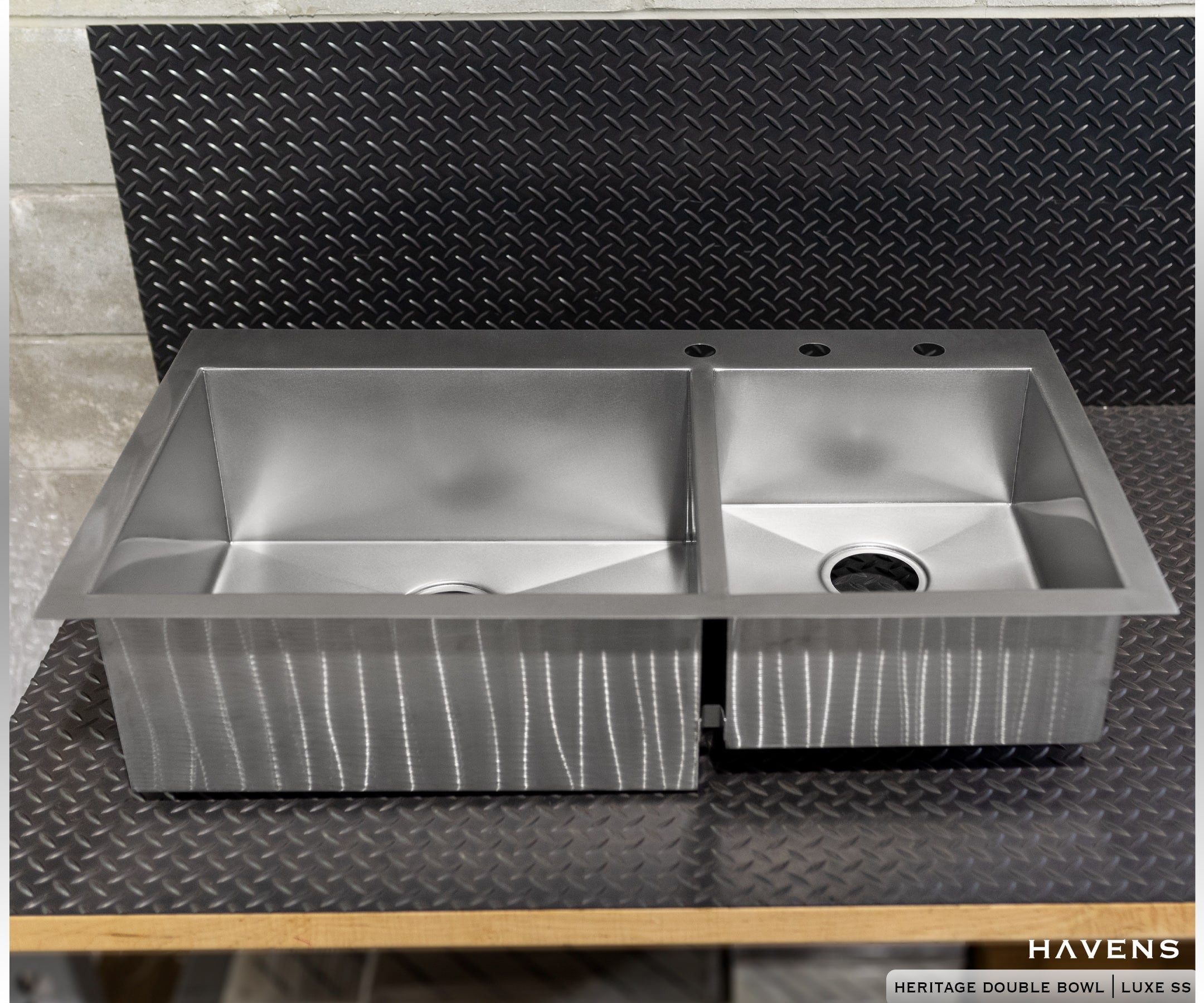 Double bowl stainless steel sink with large and small basins