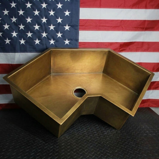 Brass Corner Sink in front of american flag