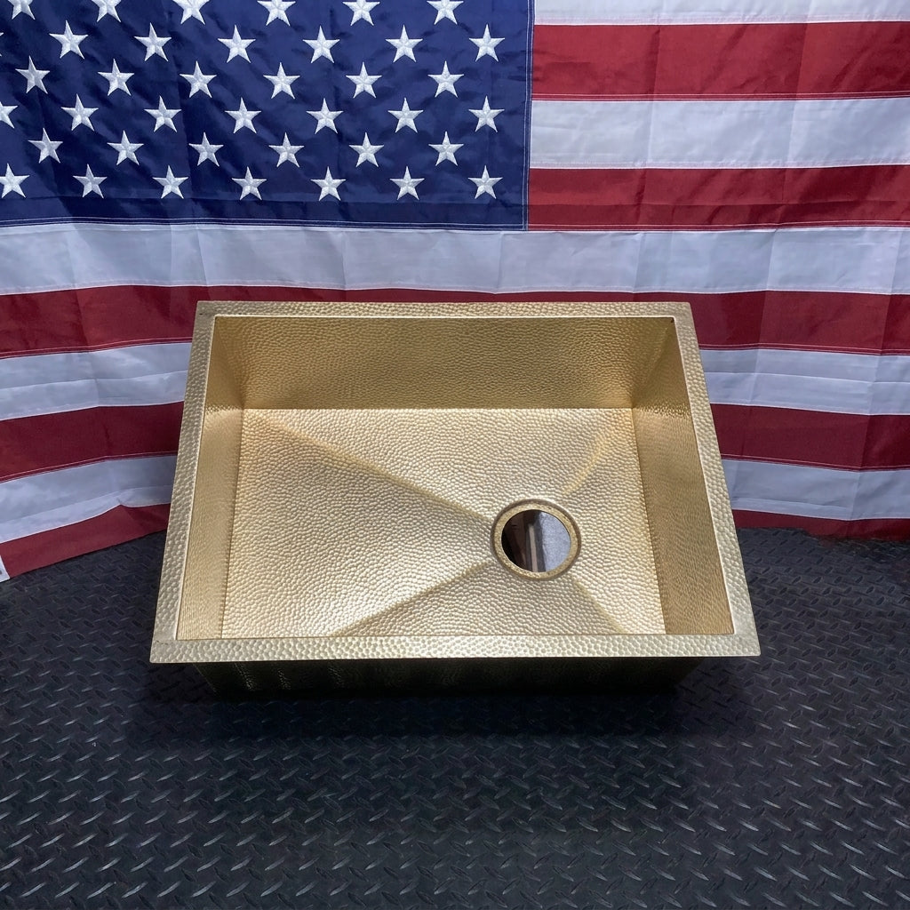 Raw micro hammered brass undermount sink, front view with right offset drain