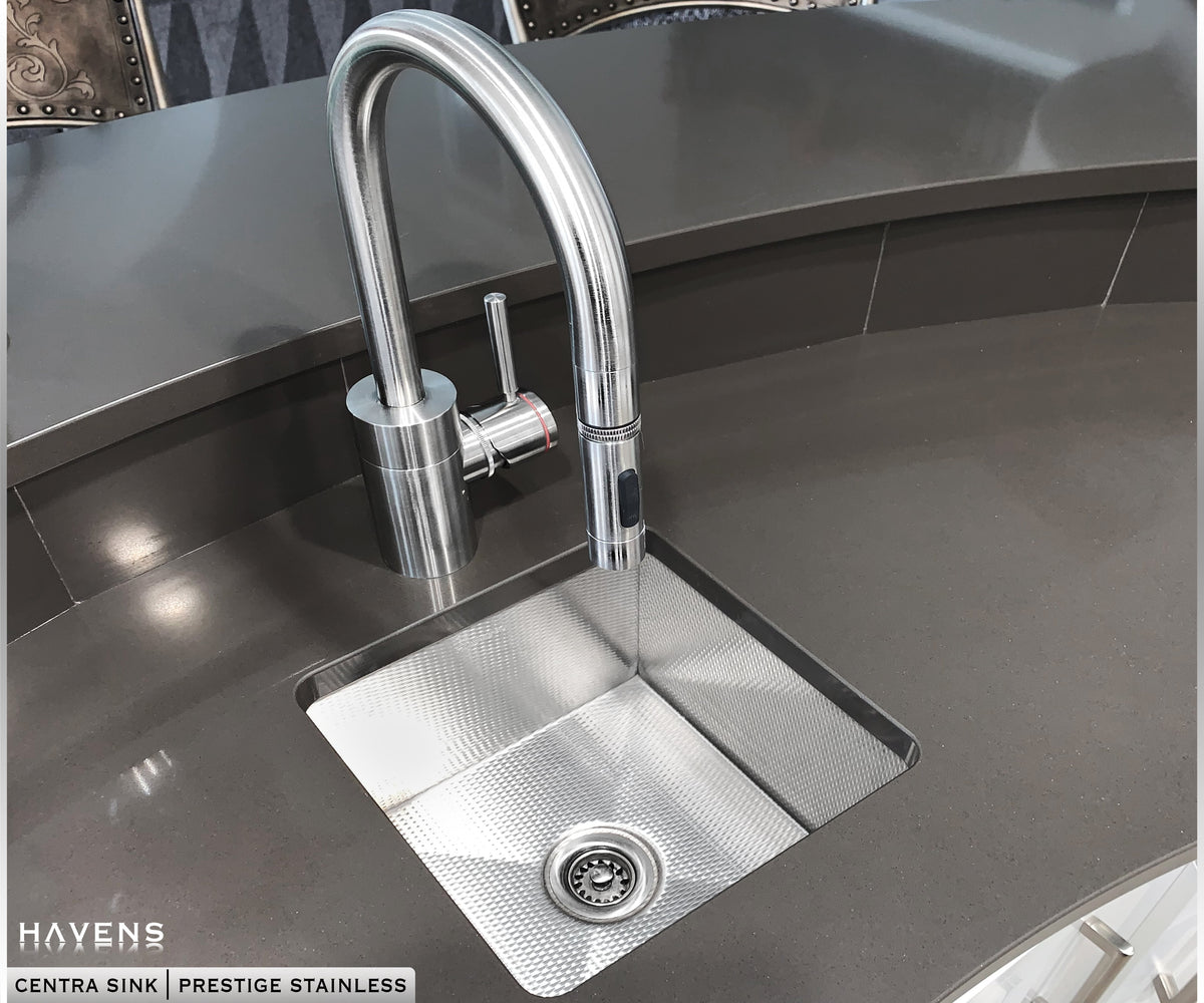 Prestige Stainless steel undermount sink in gray quartz countertop with chrome faucet
