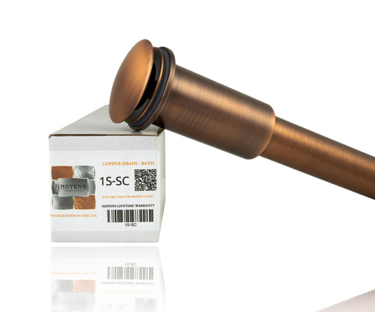 Copper bath drain shown on side with Havens Luxury Metals Packaging