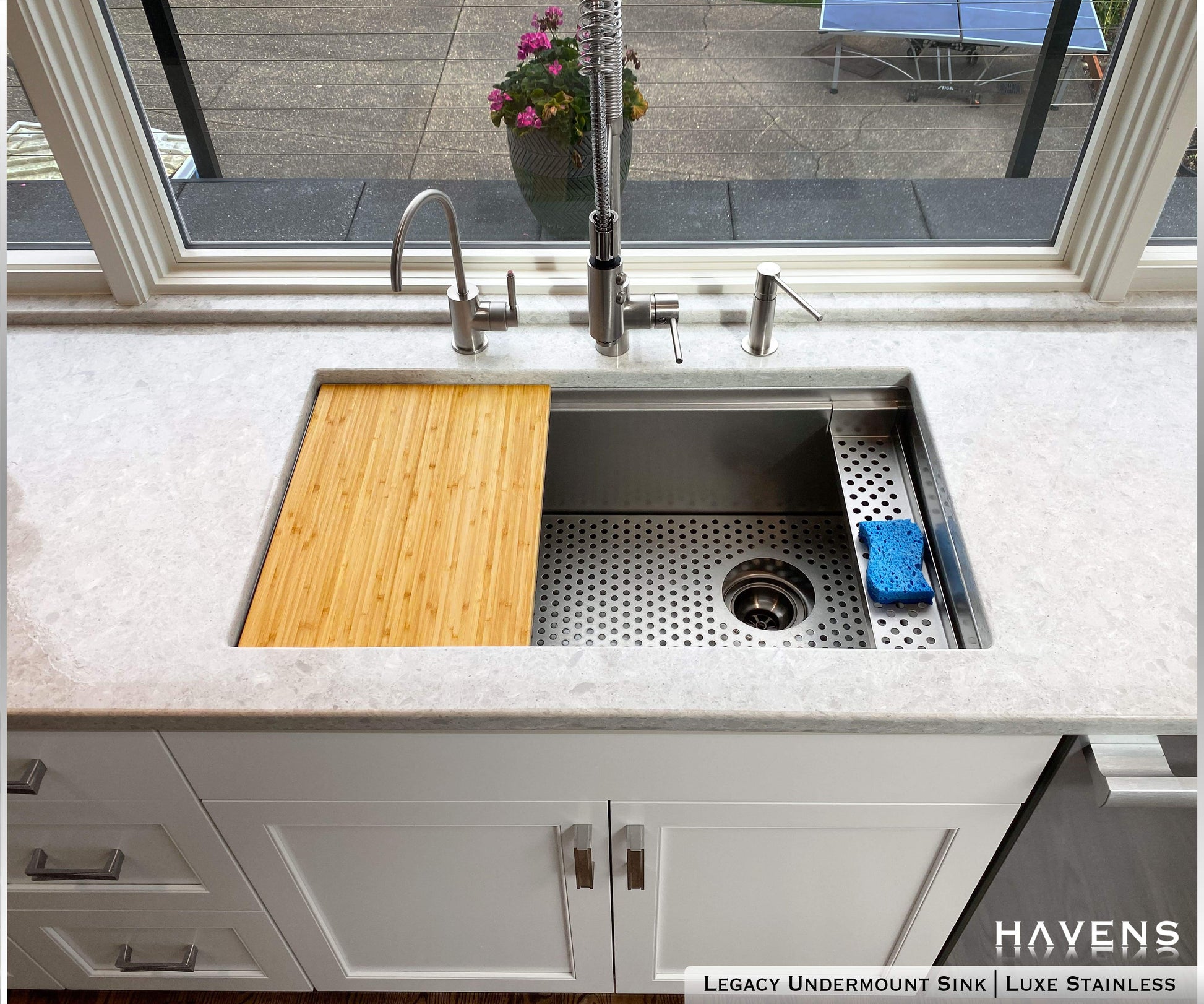 Accessory - Sponge Caddy holding blue sink sponge on the right of the sink