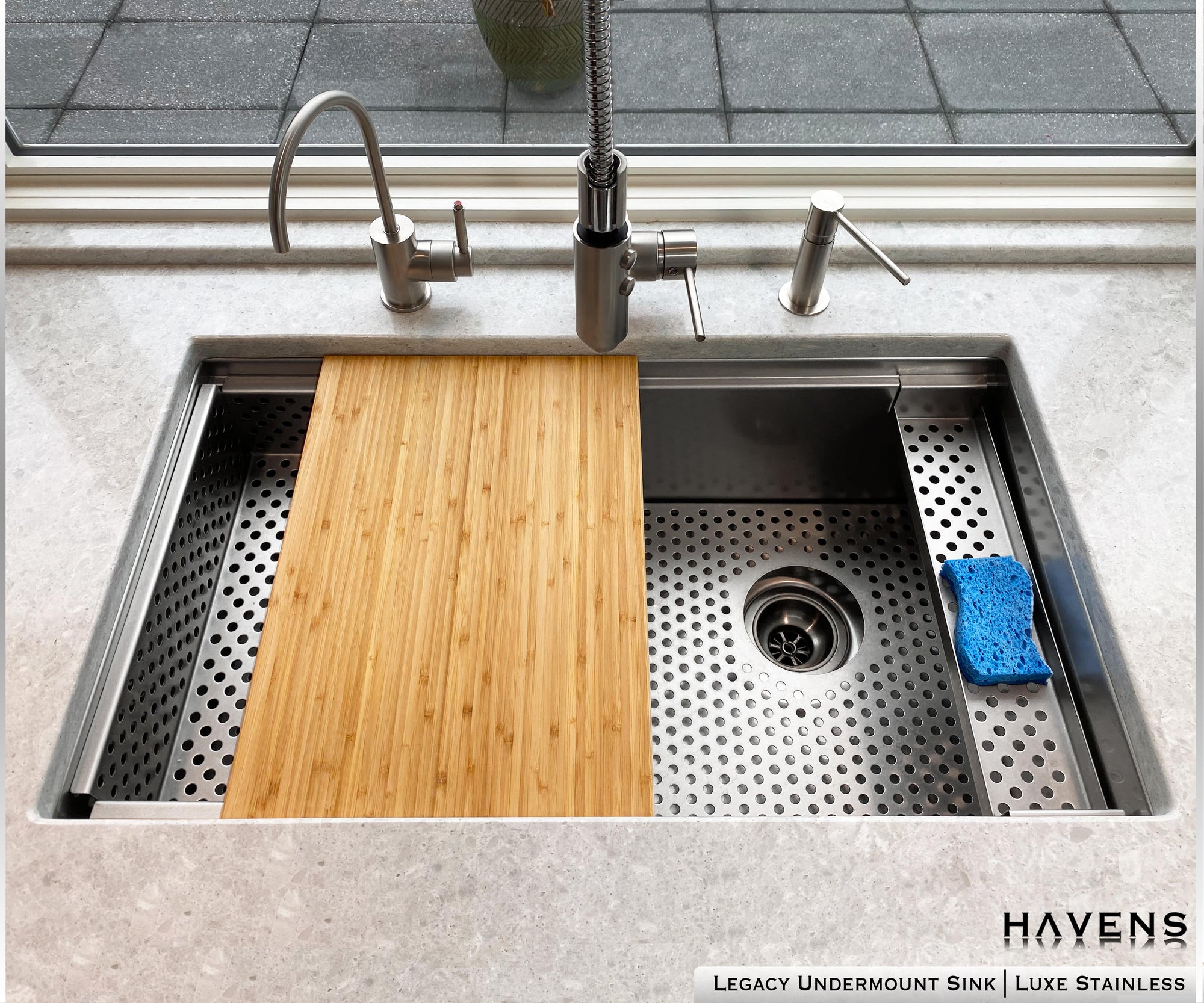 Havens | Luxury Metal Legacy Sink with basin grate, sponge caddy, and pro cutting board luxury sink accessories installed 