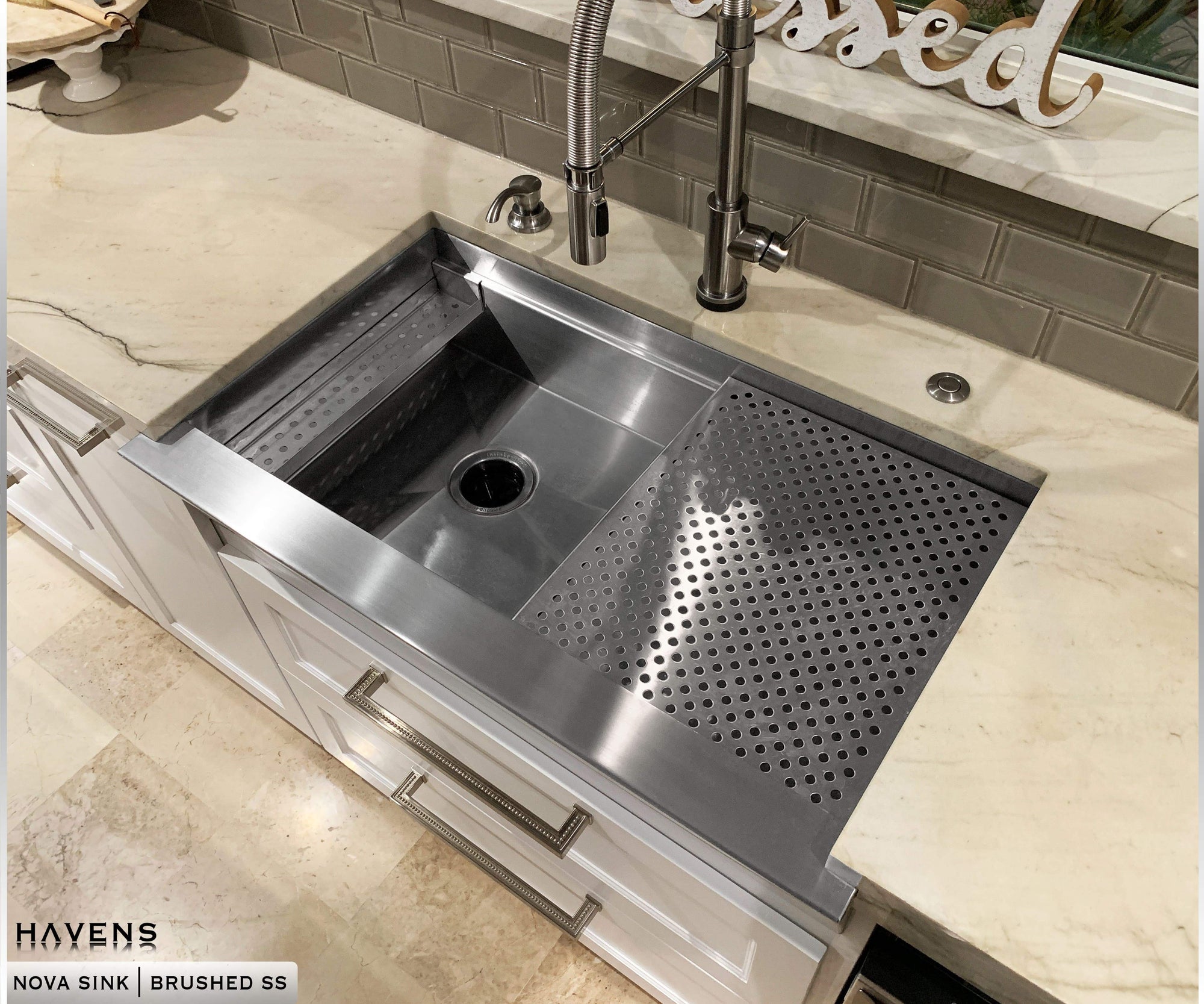 Nova Stainless Steel sink with sponge caddy installed on left of sink