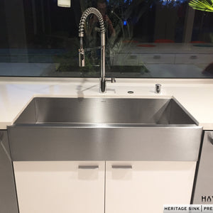 Textured stainless steel farmhouse style kitchen sink. Installed as an undermount, this stainless apron front sink is beautiful. 