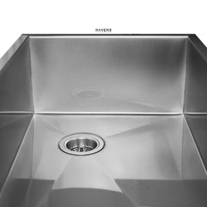 Undermount stainless steel farmhouse sink with a right rear drain.