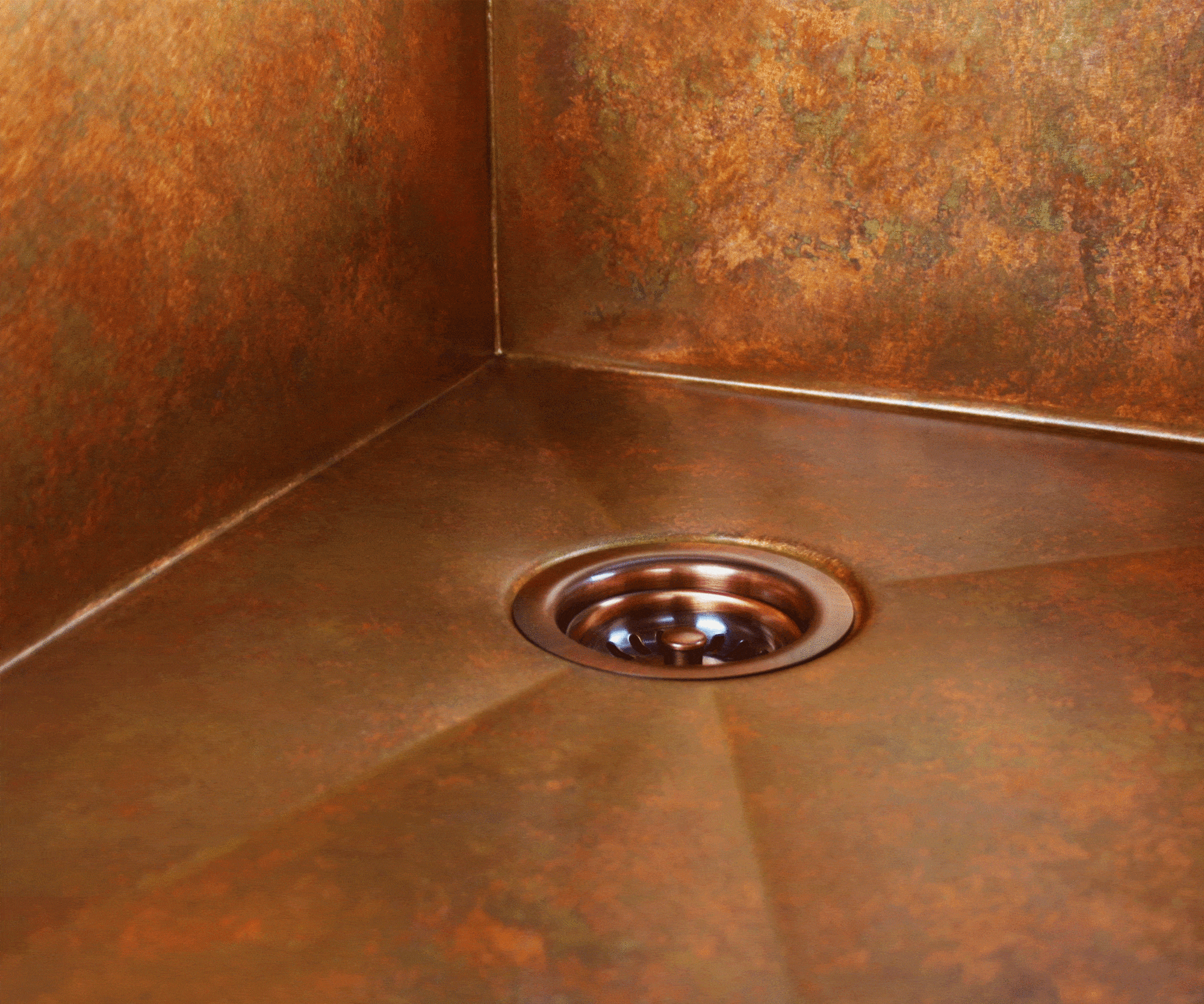 Weathered copper patina on a Havens Metal copper sink.