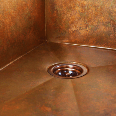 Weathered copper patina on a Havens Metal copper sink.