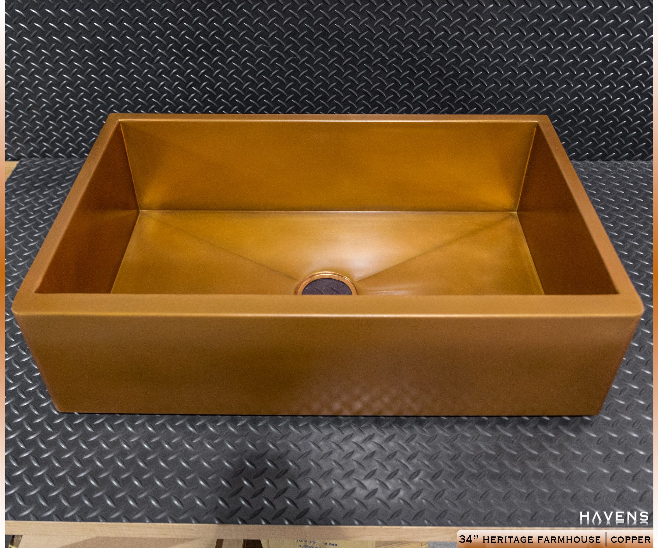 Copper apron front sink, front view showing apron face