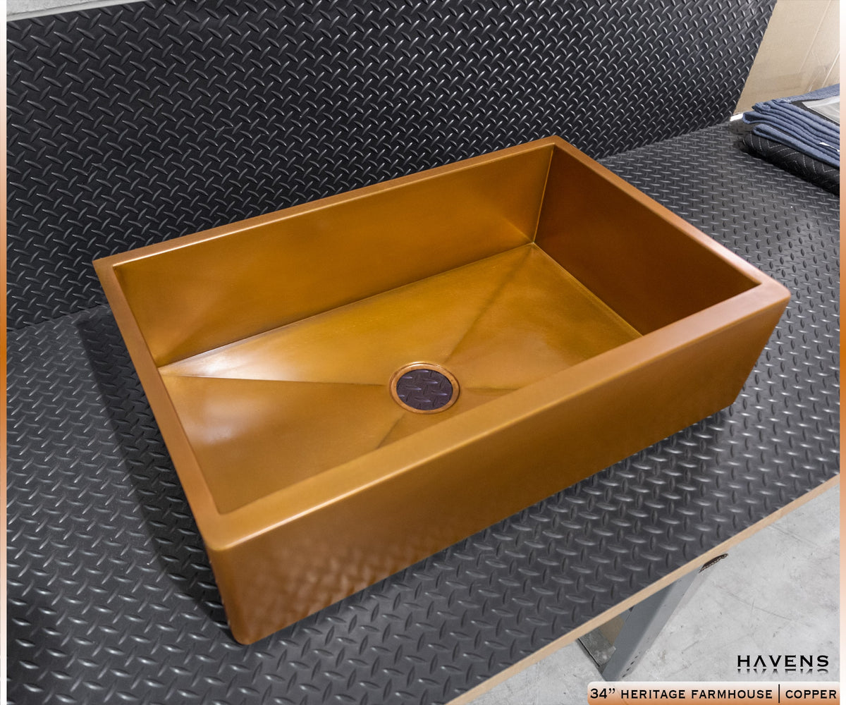 Pure copper farmhouse sink, top view of basin and center drain, made in the USA