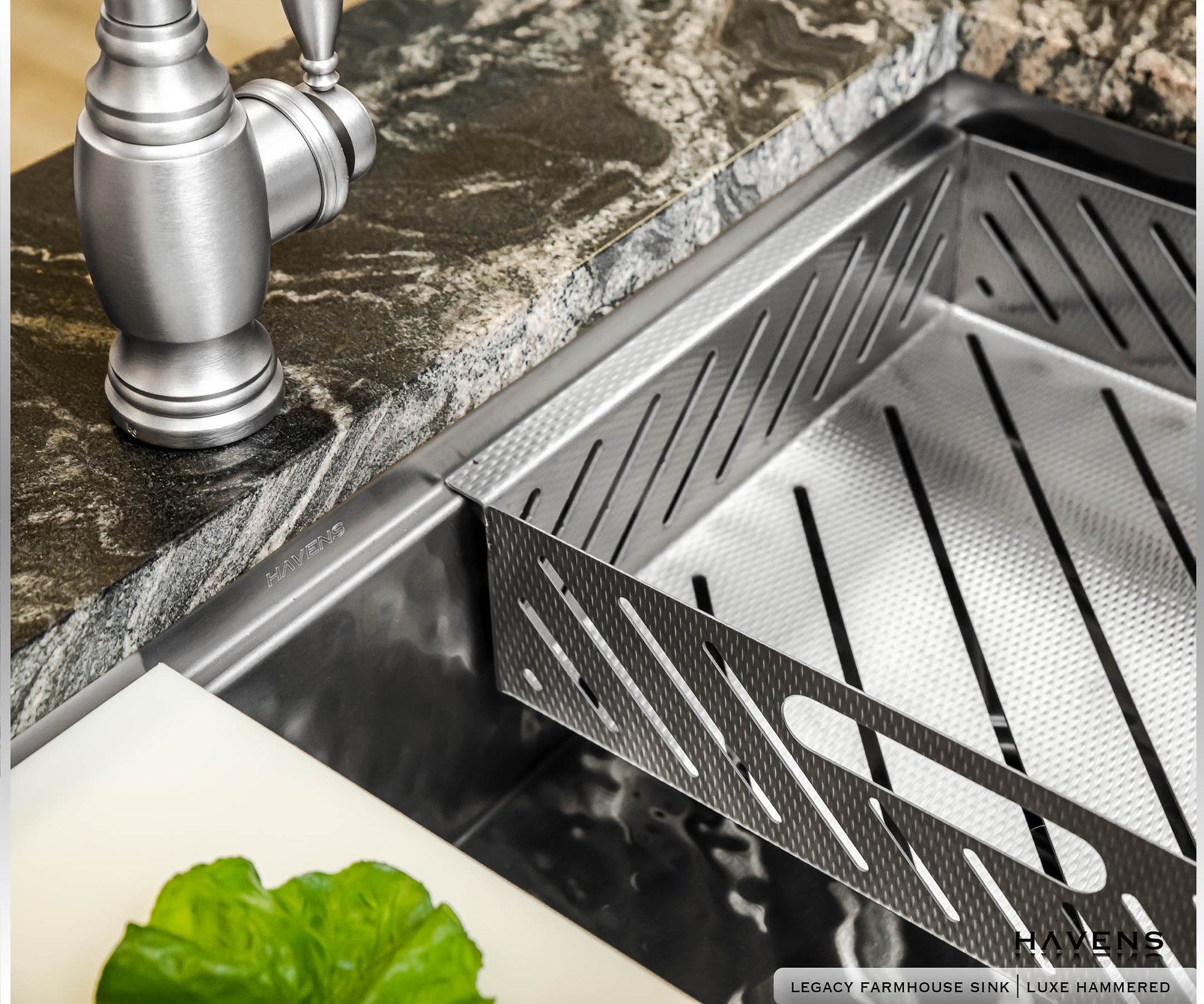 Close up side detail shot of luxury drop in strainer sink accessory in prestige stainless 