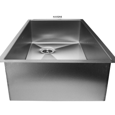 Under mount sink with a self rimming flange and right rear drain placement.