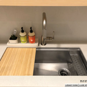 Undermount culinary workstation sink with cutting board