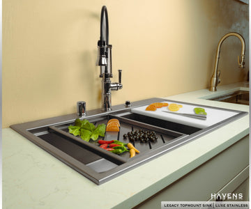 White polycarbonate pro cutting board inside ledge of topmount stainless sink 